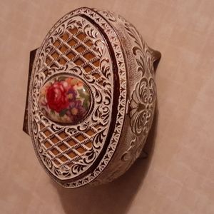 Antique metal jewelry box lined with velvet interior